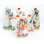 Six 19th century Staffordshire figural spill vases,