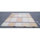 A cream and purple rectangular and square sectioned carpet, 275 x 320cm.