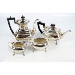 WALKER & HALL; a George V hallmarked silver four piece tea set with rounded bodies,