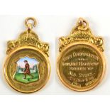 A 9ct yellow gold bowling medallion fob with shield shaped enamel image of a bowler below a crown,