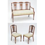 An Edwardian mahogany and inlaid salon settee, raised on square section tapering legs to spade feet,