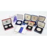 A collection of boxed silver coins comprising two silver proof coins commemorating the marriage of