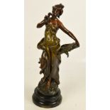 AFTER MOREAU; a late 19th century spelter figure 'La Pensée', raised on a circular wooden plinth,