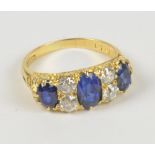 A late Victorian/Edwardian unmarked 18ct yellow gold sapphire and diamond ring,