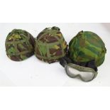 A P2 helmet with leather liner and camouflage cover,