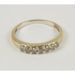 A 9ct gold and seven stone graduated diamond ring, size N, approx 2.5g.