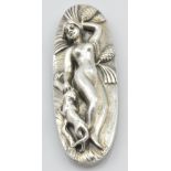 A Russian Export silver and ivorine oval plaque modelled as a naked young woman lying on her back