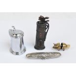 A silver plated cigar lighter in the form of a pig, an American novelty golf bag and club lighter,