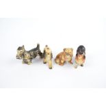 Four celluloid dogs comprising a Highland terrier, a cocker spaniel,