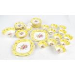 A part tea service of yellow and floral decorated 'Ye Olde English Grosvenor China',