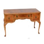 An early 20th century walnut three drawer kneehole desk/dressing table,