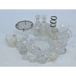 A quantity of predominantly cut glass salt cellars, three silver rimmed cut glass shot glasses,