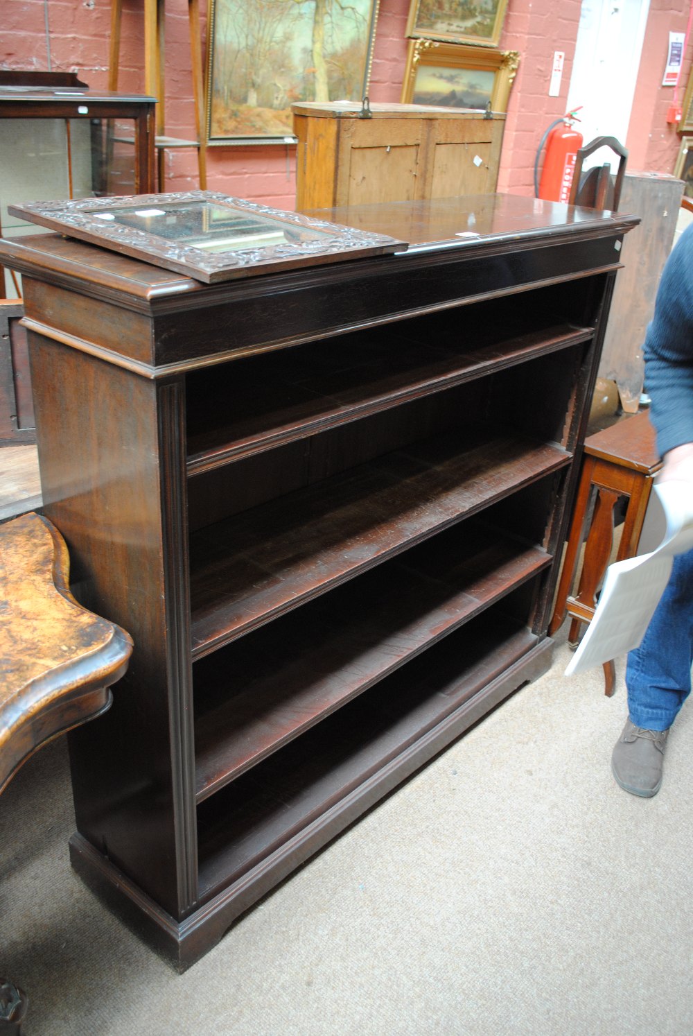 A late Victorian walnut pot cupboard, an open bookcase and an oak plant stand (3).