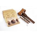 A stereoscope card viewer with a large quantity of stereoscope cards,