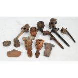 A group of Peruvian artefacts including 18th century harvest head pipes, some more recent editions,