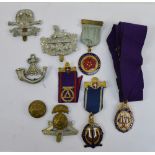 A collection of Oddfellows and cap badges including a 9ct yellow gold Independent Order of