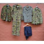 A quantity of Dutch military uniforms including a KLM Kleding camouflage tank suit,