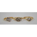 Three 18ct yellow gold three stone rings including an Art Deco style diamond illusion set example,