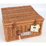 An unused Optima wicker picnic set.