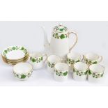 A Crown Staffordshire six piece coffee service with gilt and ivy decoration.