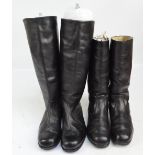 A pair of knee-length black leather boots and a pair of mid-length black leather boots.