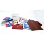 A large collection of presentation packs of proof and uncirculated coins including British proof