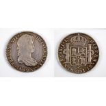 A Spanish Ferdinand VII 1825 8 reales coin.