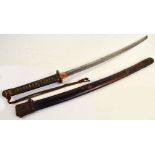 A Japanese katana with shagreen bound grip applied with a signed small silver button,