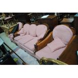 An early 20th century mahogany framed five piece bergère suite comprising settee and matching