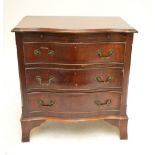 A late 19th century mahogany serpentine chest of drawers,