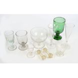 A collection of drinking glasses including an outswept conical ale glass with two knops to the stem,