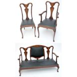 An Edwardian mahogany and inlaid five piece salon suite comprising settee on cabriole legs with pad