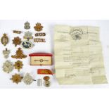 A quantity of military badges and cap badges including a Royal Corps of Signals cap badge,