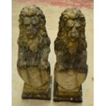 A pair of reconstituted stone Marzocco type seated lion statues, resting their paws on shields,