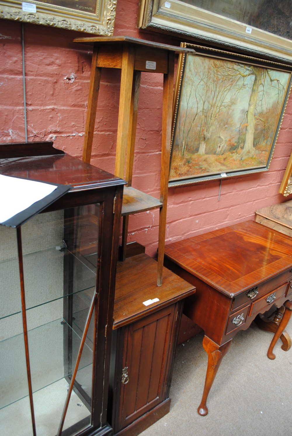 A late Victorian walnut pot cupboard, an open bookcase and an oak plant stand (3). - Image 2 of 2