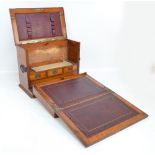 An Edwardian oak stationery box and writing slope,