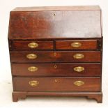 A George III mahogany bureau with fitted interior and two short above two long drawers on bracket