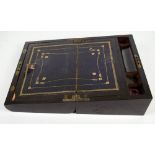 A Victorian coromandel writing slope with inlaid mother of pearl decoration and curved front,