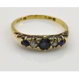 A late Victorian/Edwardian 18ct yellow gold sapphire and diamond five stone graduated ring in