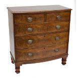 A Victorian mahogany bowfront chest of two short and three long graduated drawers raised on turned