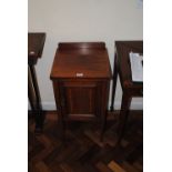 An Edwardian mahogany crossbanded pot cupboard with single door on tapering legs, length 39cm,
