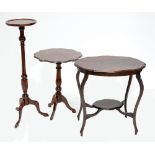 An oval mahogany two tier occasional table with shaped top,