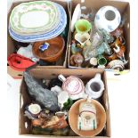 Three boxes of decorative ceramics and glassware.