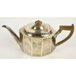 THOMAS BRADBURY & SONS LTD; a George V hallmarked silver teapot of oval faceted form, length 28cm,