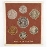 A 1950 Republic of India Bombay Mint seven coin set, in original brown card setting.