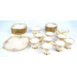 A Paragon part tea service, consisting eight tea cups, eleven saucers, a cream jug,