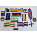 A small collection of medals comprising a Monte Cassino Commemorative Cross,