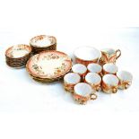 A part Limoges blush tea service consisting eight tea cups and saucers, eight tea plates,