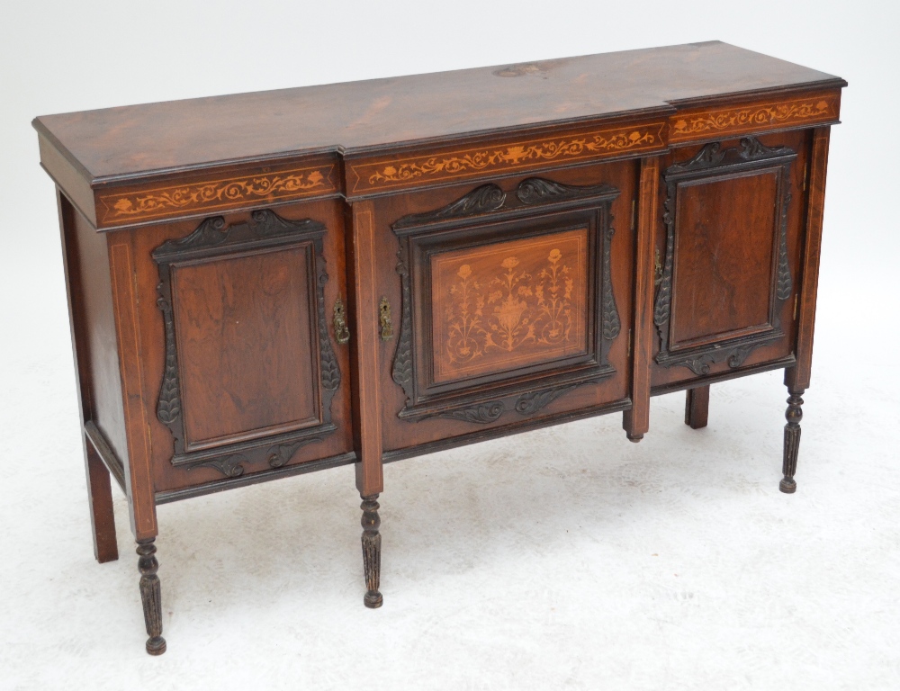 An Edwardian rosewood and inlaid chiffonier base with three cupboard doors and turned legs,