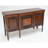 An Edwardian rosewood and inlaid chiffonier base with three cupboard doors and turned legs,